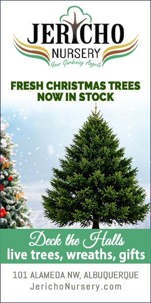 Jericho Nursery ad banner with logo, showing a full evergreen Christmas tree and the message 'Fresh Christmas Trees Now in Stock' with 'Deck the Halls' promoting trees, wreaths, gifts at 101 Alameda NW, Albuquerque, NM.