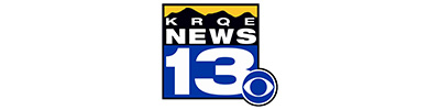 KRQE News 13 logo with blue 13 and CBS eye symbol on a yellow-accented badge