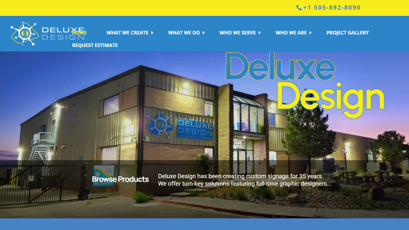 Exterior view of the Deluxe Design office building at dusk, with the blue company sign on the facade and a large 'Deluxe Design' headline overlay.