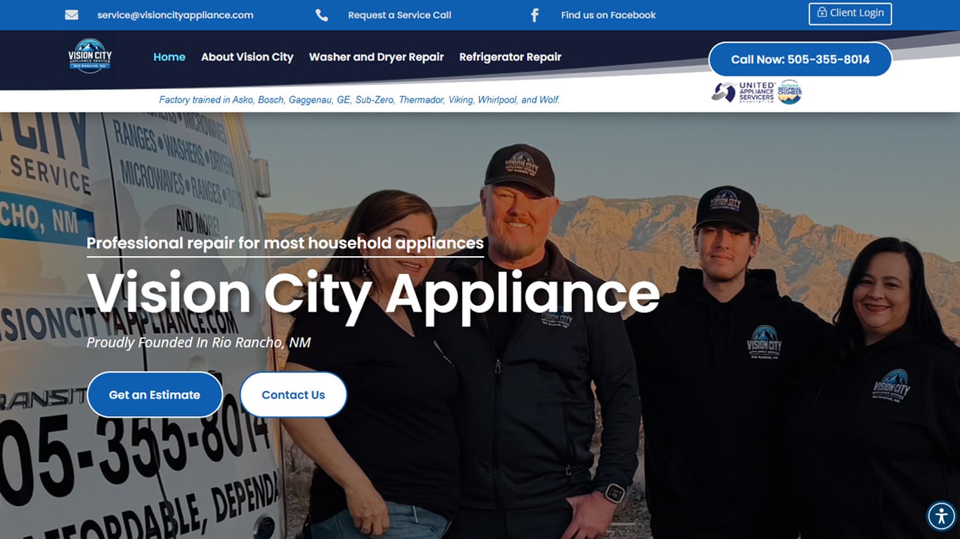 Team photo of Vision City Appliance employees in branded hoodies standing in front of a service van against a desert mountain backdrop in Rio Rancho, NM.